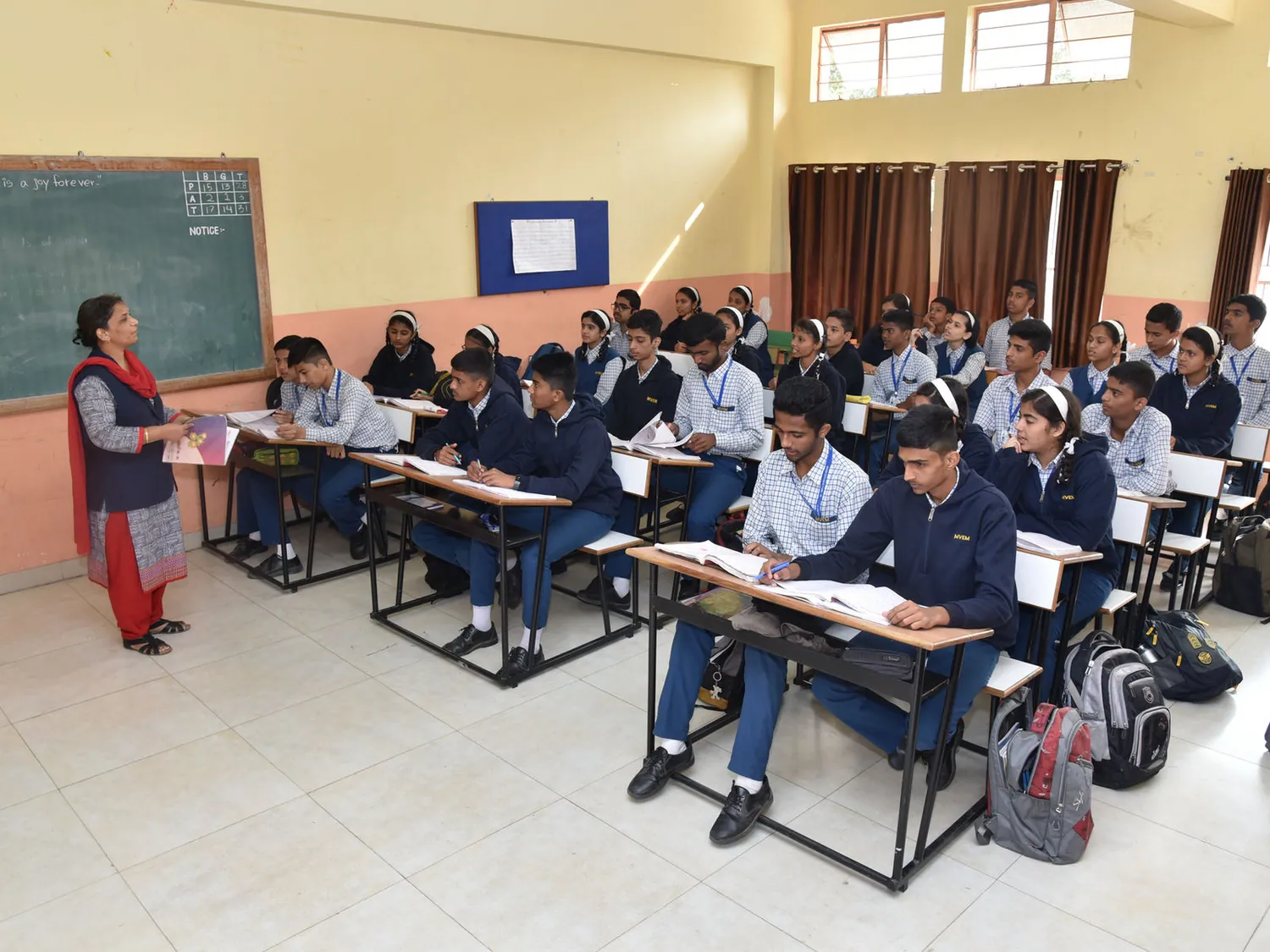 Students in a bright classroom