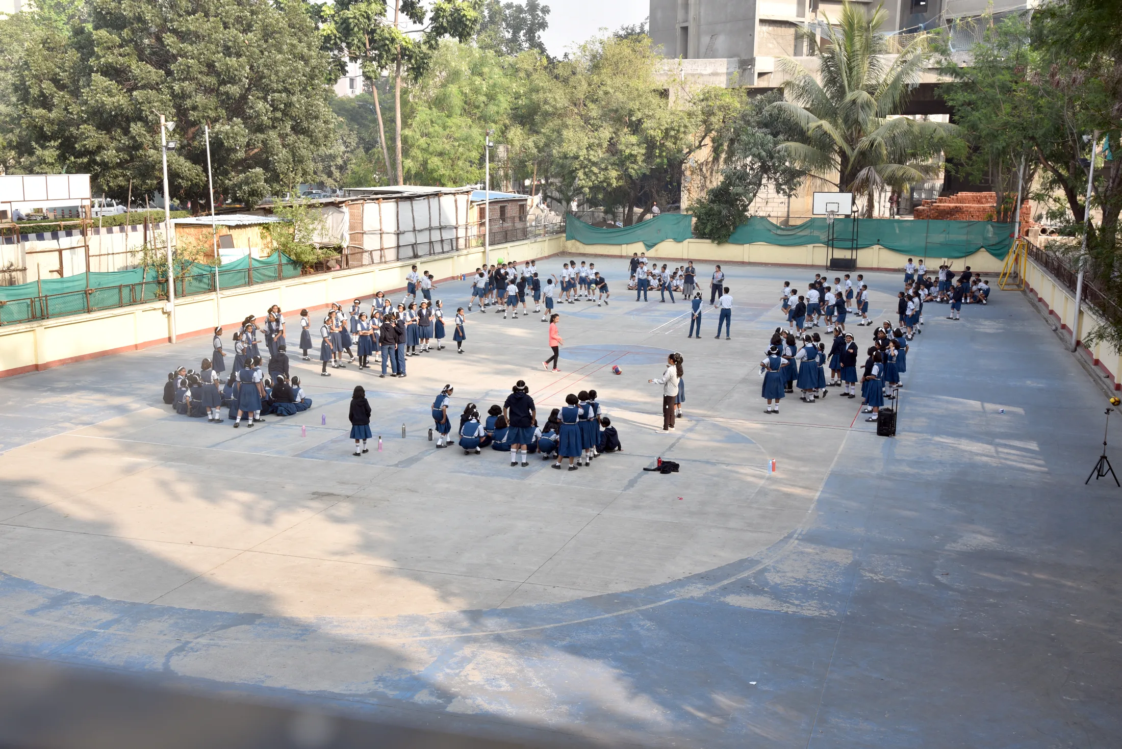Children gathered in groups across the school ground