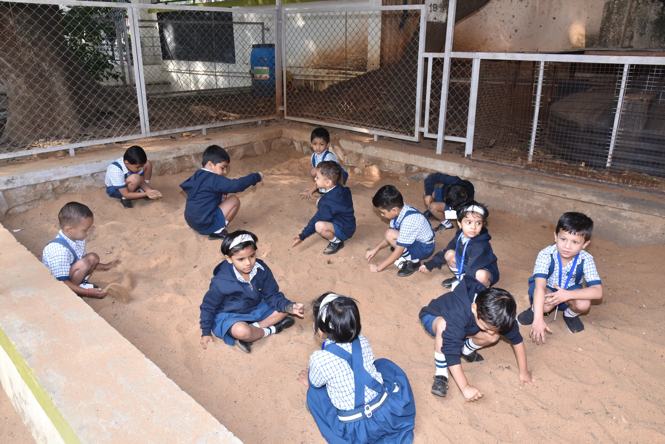 Pre-primary children at play in the sand pit