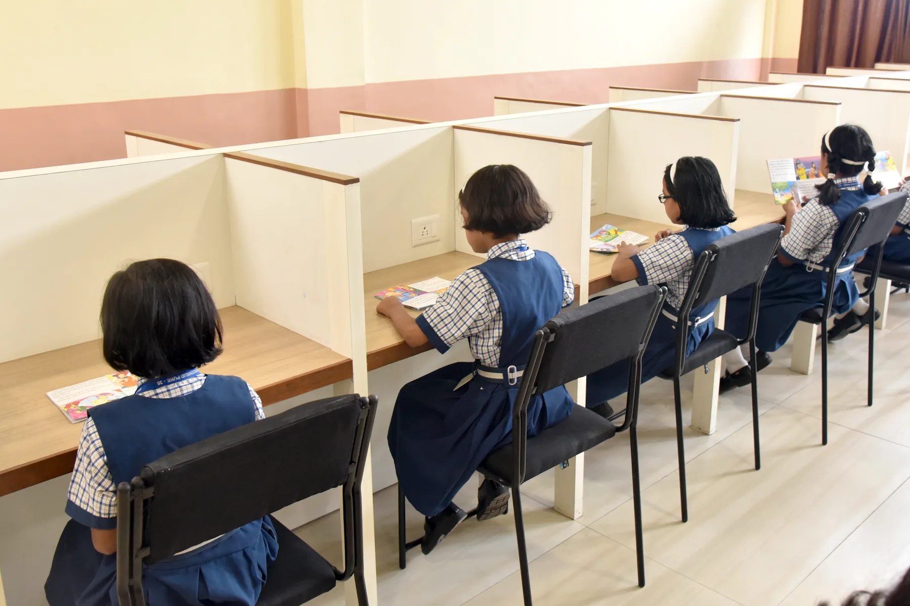 Students working at individual study booths