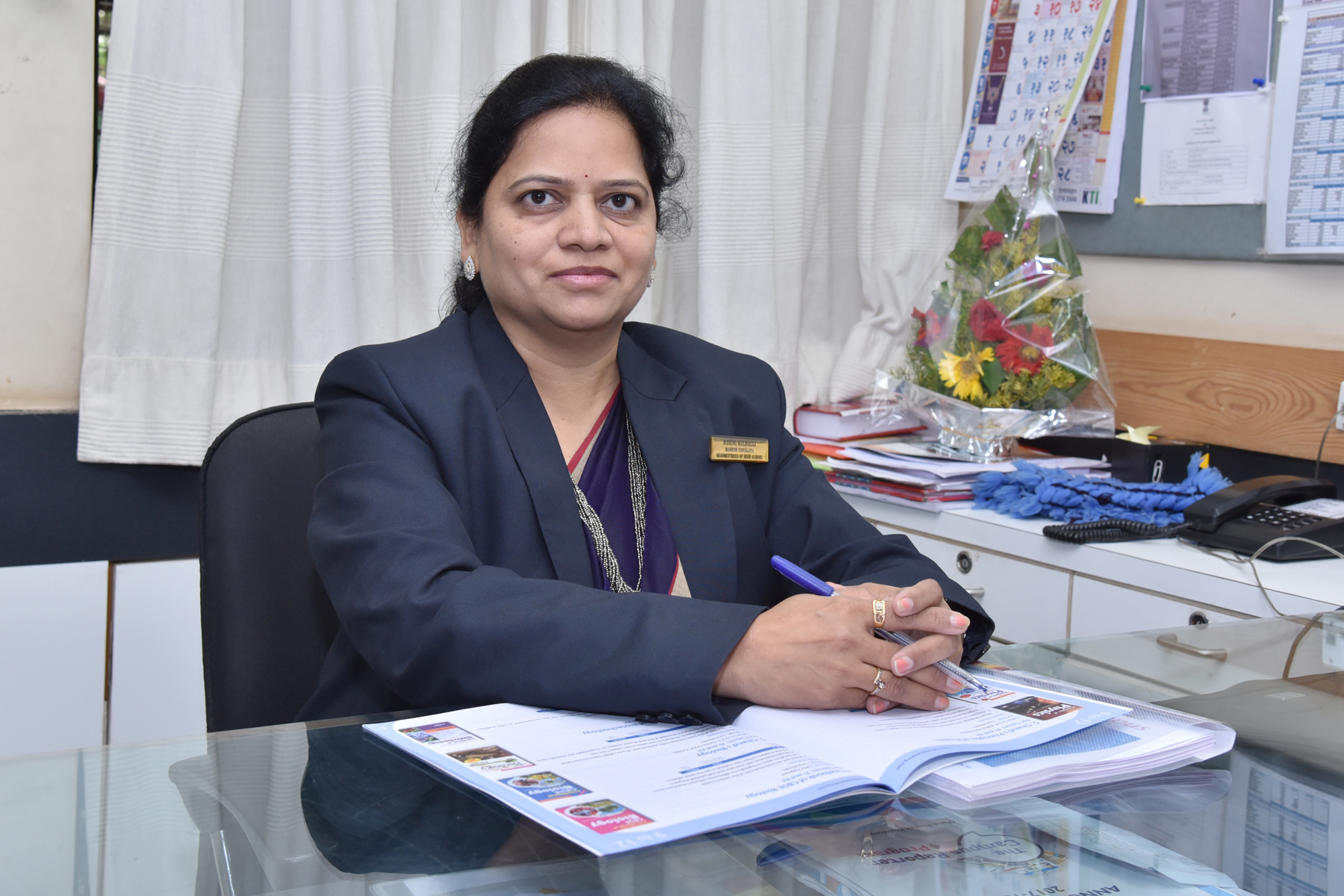 Mrs. Ashwini Mujumdar, Principal of MVEM, at her desk